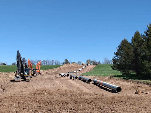 Sections of the new CM-6 natural gas pipeline lined up in place and awaiting installation.